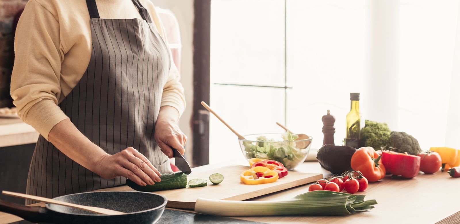 Woman cooking a fresh meal at home