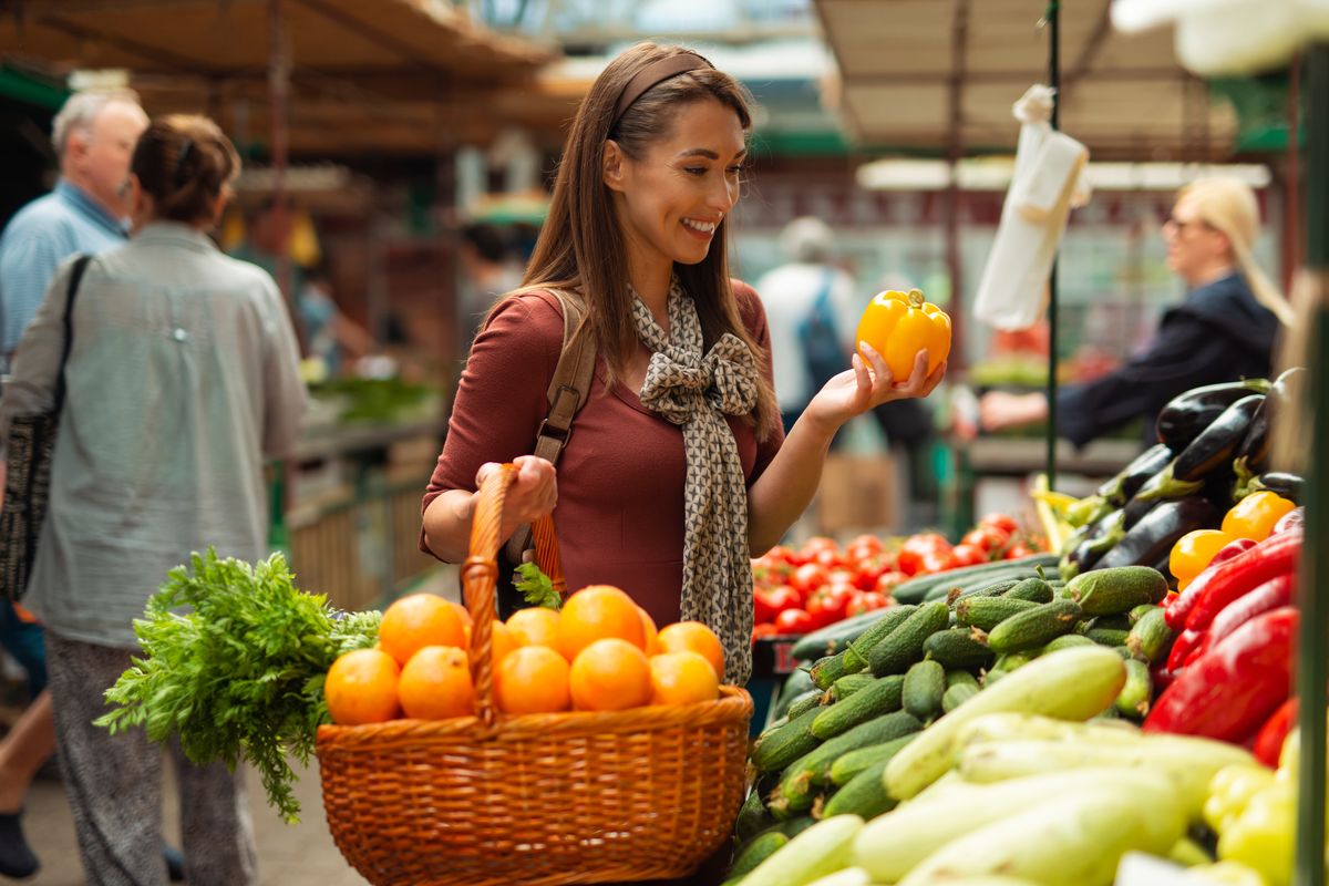 Woman choosing fresh fruit at a market